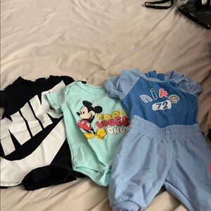 Nike Blue Infant One-Piece Romper with Playful Logo